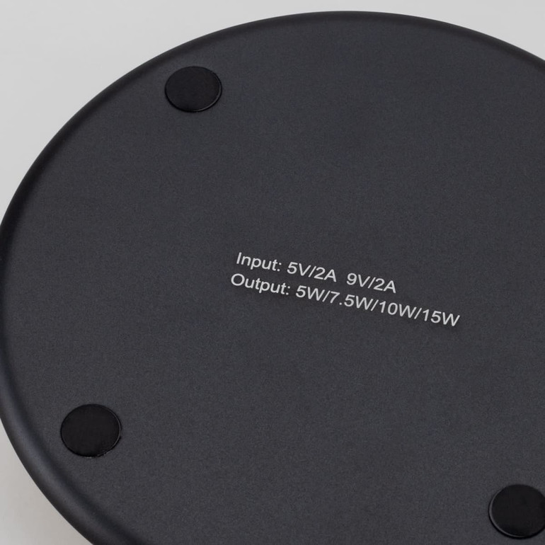 A Bamboo 15W wireless fast charger in a sleek black design, featuring a smooth surface and rubberised base for stability.