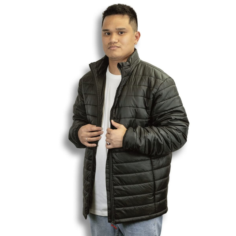 A man wearing a black puffer jacket with a zip front. The jacket features a stand collar and has a subtle logo.