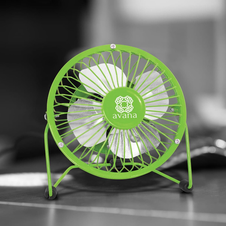 A green Nexion Desk Fan with a metal base and blades, featuring a branding logo on the front.