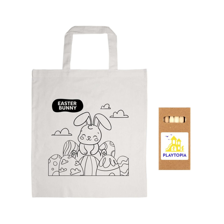 A cotton bag featuring a bunny illustration and a set of colored pencils in a kraft box. The bag is white.