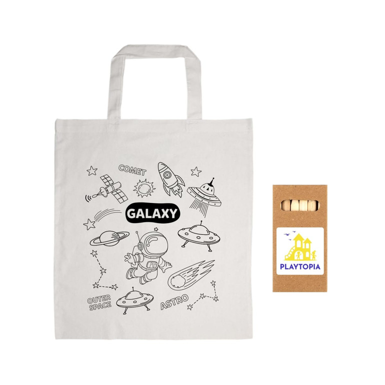 A cotton bag featuring a galaxy-themed design with spaceships and an astronaut, alongside a set of colored pencils.
