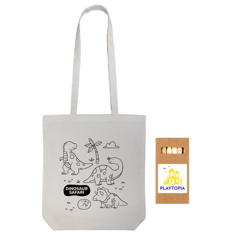 A cotton tote bag with a dinosaur-themed design and a set of colored pencils in a cardboard box featuring a logo.