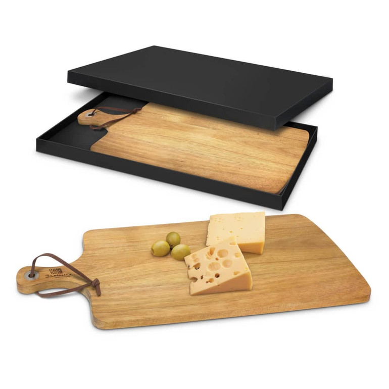 A wooden serving board with a handle, displaying cheese and olives, presented in a black box.