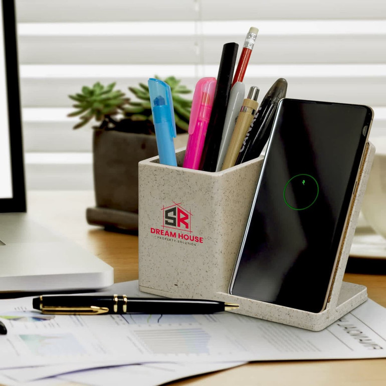 A cardboard box containing the NATURA Oaken Wireless Charger Desk Caddy, featuring a minimalist design and a logo.