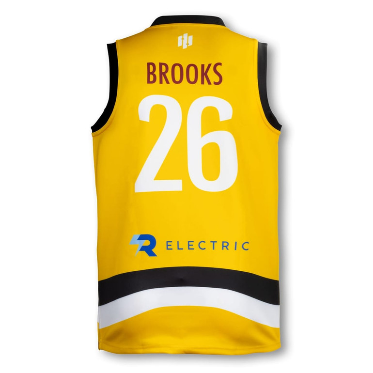 A yellow men's AFL top featuring a black and white stripe, with a name and number on the reverse, and a logo.