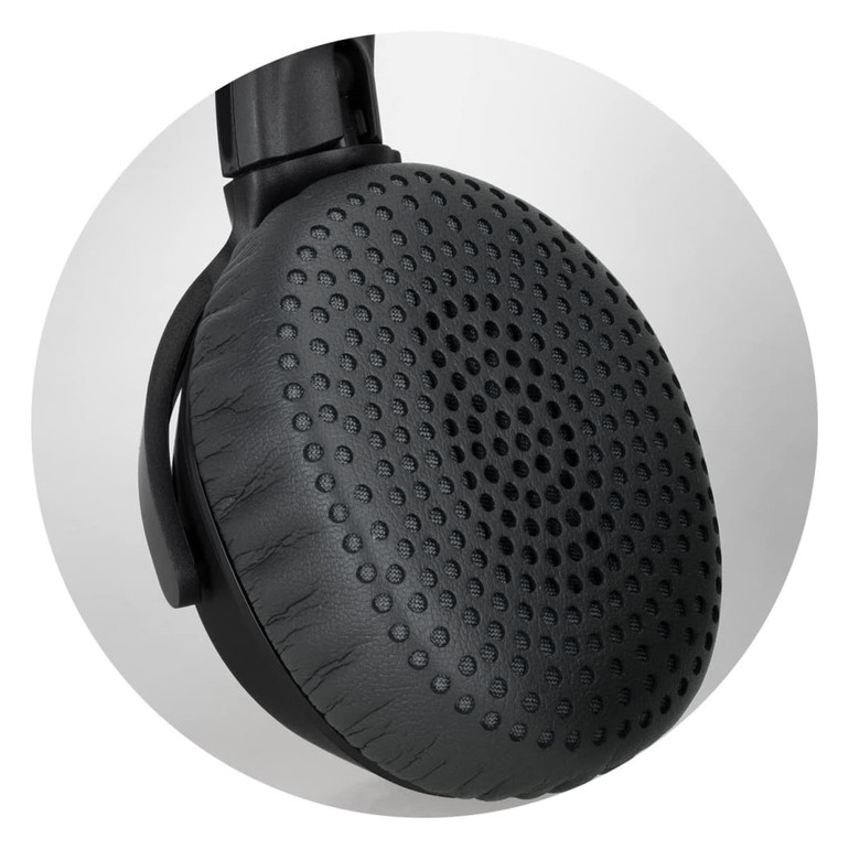 A close-up of a black headphone earcup featuring a textured surface and a circular design pattern.