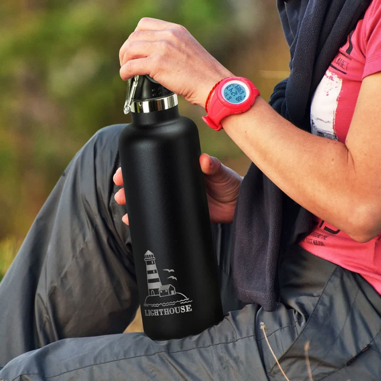 A drink bottle in matte black with a silver lid, featuring a lighthouse design and a logo.