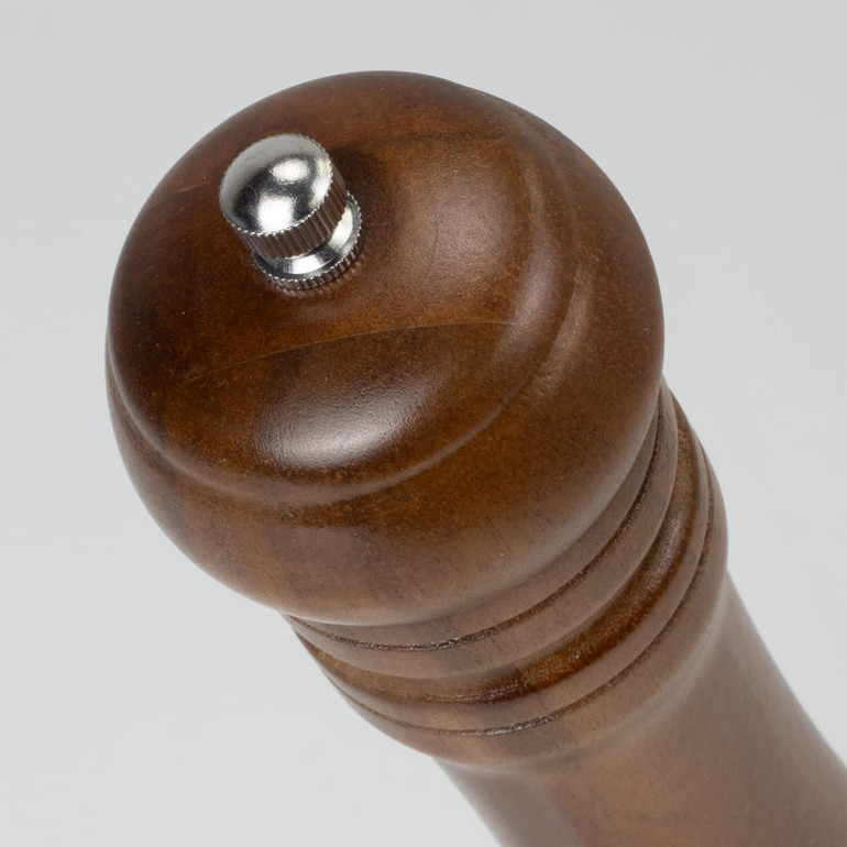 A wooden pepper mill with a polished finish and metallic adjustment knob on top.