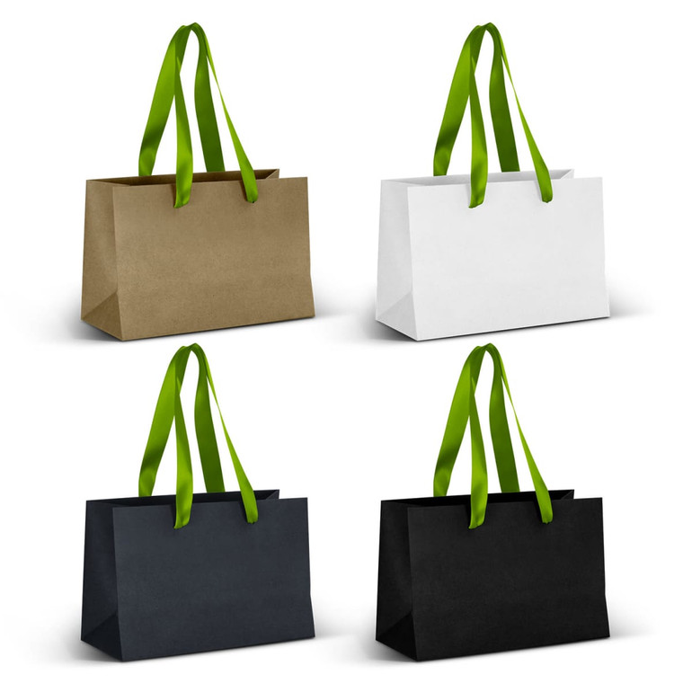 Four small ribbon handle paper bags in olive green, white, navy blue, and black, featuring green handles.