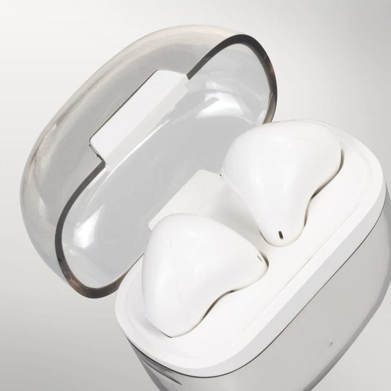 White Bluetooth earbuds in a transparent charging case, featuring a smooth, modern design.