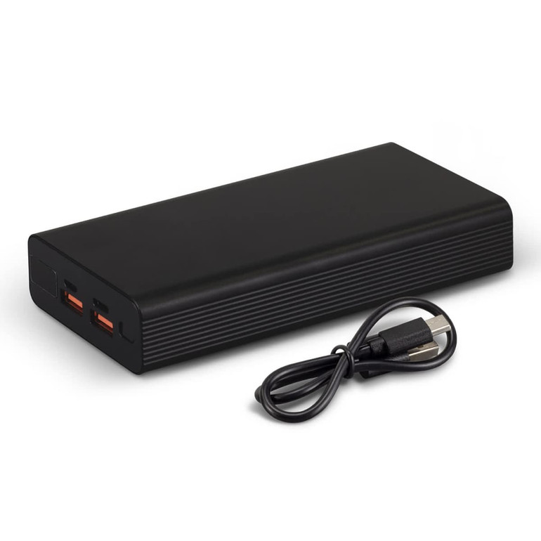 A black power bank with two output ports and a USB charging cable beside it.