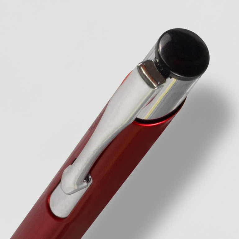A red metal pen with a shiny silver clip and a black top. The image includes a logo on the pen.