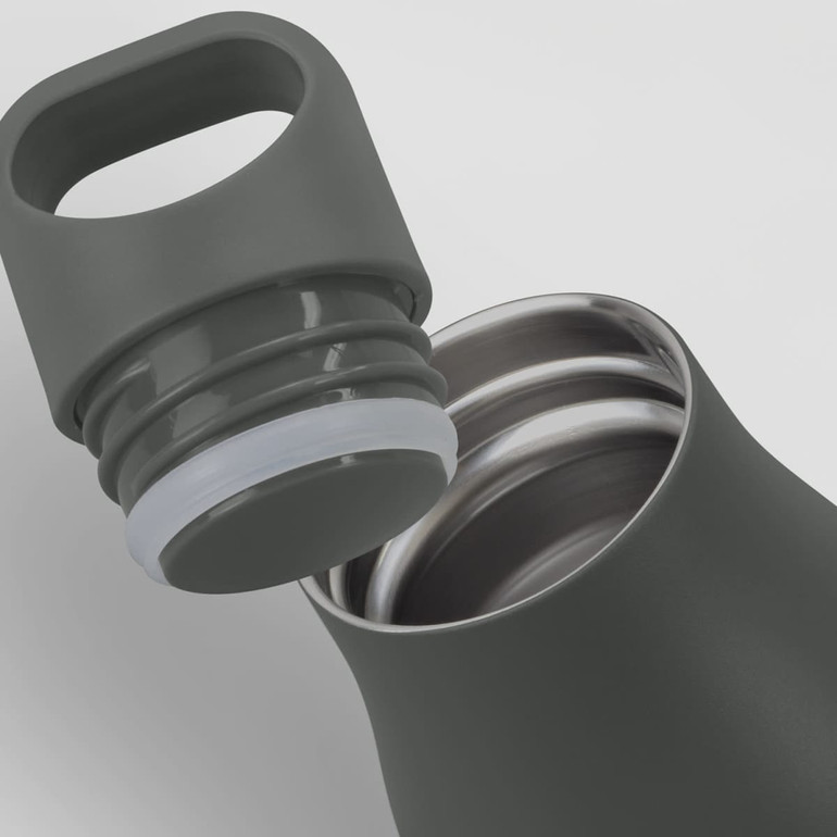 A drink bottle in a dark green colour with a silver interior and a removable lid featuring a handle.