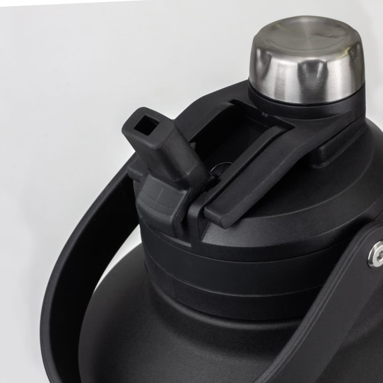 A drink bottle in black with a stainless steel cap and a detachable spout, featuring a sturdy handle and branding.