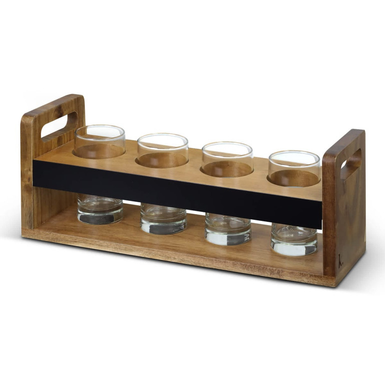 A wooden taster tray in natural hues with a black centre section, featuring four glass cups set in circular holders.
