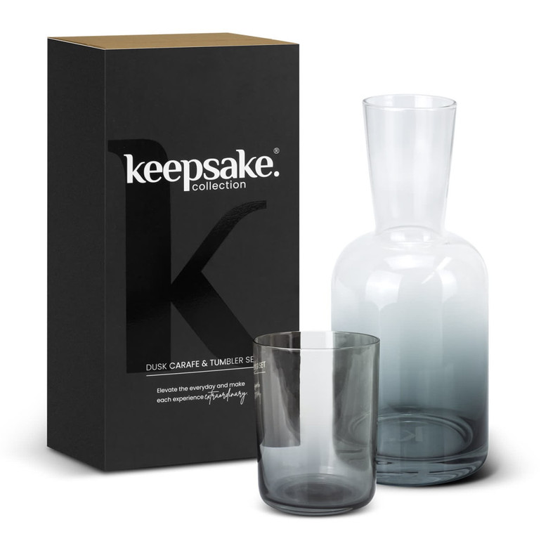A glass carafe and tumbler set in grey, packaged in a black box with a logo.