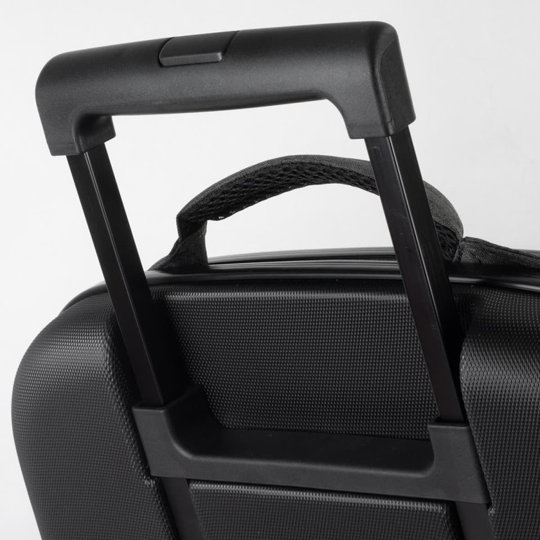 A close-up of a black wheeled suitcase handle, featuring a textured surface and a retractable mechanism.