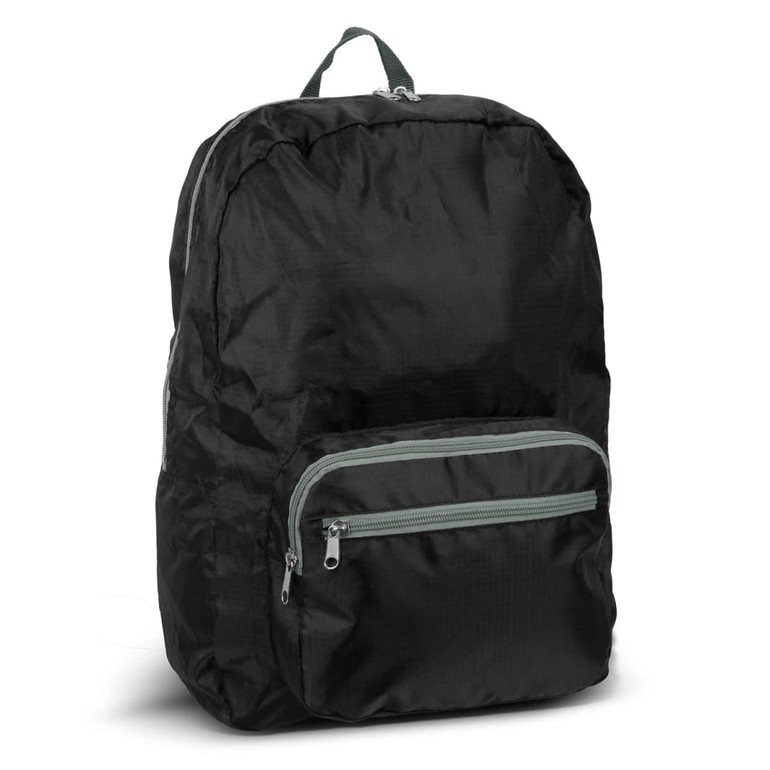 A foldable backpack in black with a green zippered front pocket, featuring a carrying handle on top.