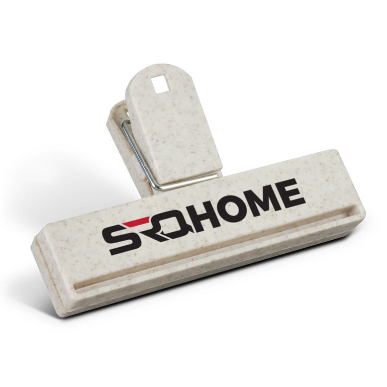 A cream snack bag clip with a logo, featuring a sturdy grip and a wide opening for securing bags.