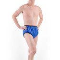Model wears waterproof diaper cover for adults, royal blue silence pants, facing forward.