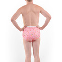 Middle-aged man wearing Pink Butterfly - Waterproof diaper covers for adults, known as PUL pants or silence pants.