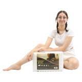 Model with glasses wears a BeDry Night diaper, sitting on the ground with her arm resting on a bag of BeDry Night diapers. Model with glasses wears a BeDry Night diaper, sitting on the ground with her arm resting on a bag of BeDry Night diapers.