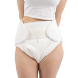 Close up of model wearing Harmony cloth diaper, her hands are behind her back. Close up of model wearing Harmony cloth diaper, her hands are behind her back.