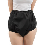 Model wears leak protection Christy Waterproof Silence Pants in colour black, her hands are behind her back. Model wears leak protection Christy Waterproof Silence Pants in colour black, her hands are behind her back.