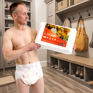 Active Air Briefs on male model holding bag of Active Air.