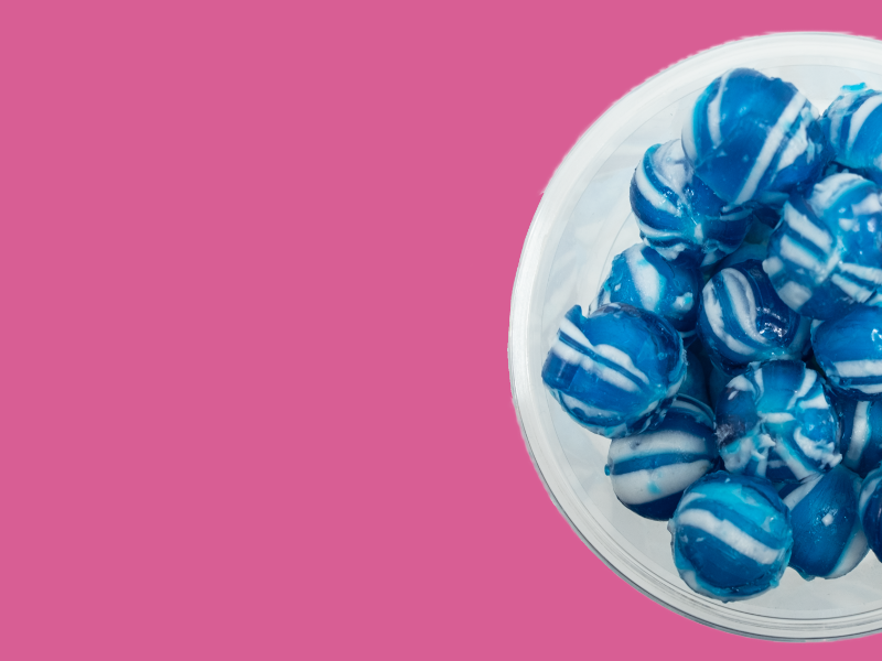 bowl of scottish sweets on pink background