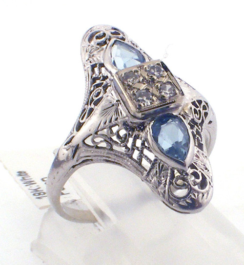 18 karat white diamond and aquamarine antique filligree ring weighing 3.2 grams.  Finger size 6.25