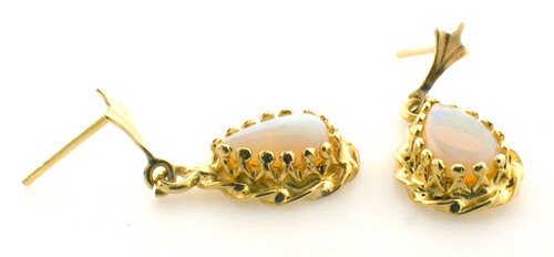 14 karat yellow gold opal earrings weighing 2.2 grams. Opals are 8x5 mm