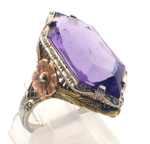 14 karat tri color purple stone ring weighing 4.5 grams.  Finger size 6