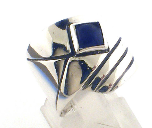Sterling silver blue stone (chipped) ring weighing 7.8 grams. Finger size 6.75 Sterling silver blue stone (chipped) ring weighing 7.8 grams. Finger size 6.75
