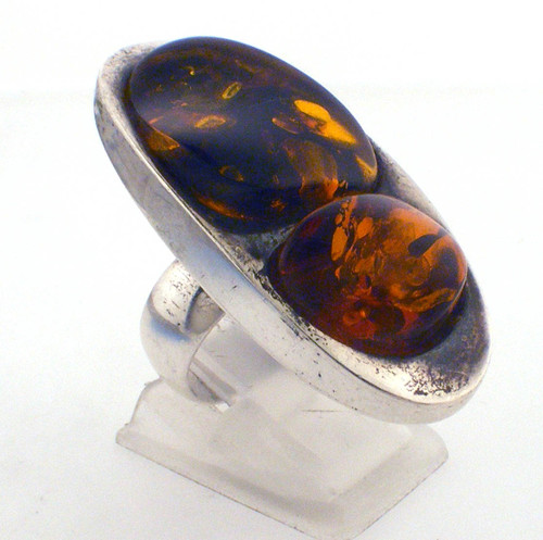 Sterling Silver Amber ring weighing 13.4 grams. Finger size 6.5 Sterling Silver Amber ring weighing 13.4 grams. Finger size 6.5