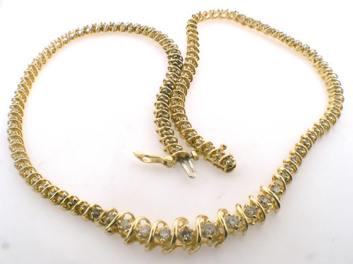 14 karat yellow gold 17 inch Diamond tennis necklace weighing 27.5 grams.  Diamonds weigh a total of approx 2.75 ct