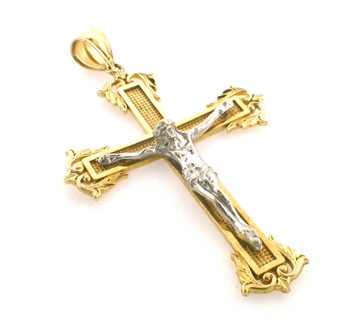 10 karat 2 tone crucifix pendant weighing 5.2 grams