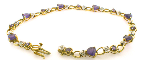 14 karat yellow gold amethyst and diamond bracelet weighing 5.2 grams.  7 Inches in length.