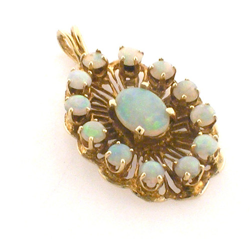 14 karat yellow gold opal pendant weighing 3.5 grams