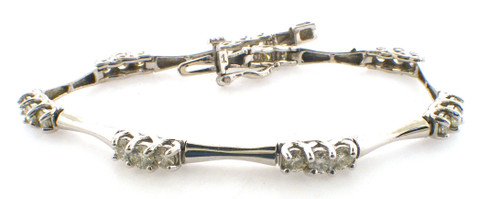 14 karat white gold 7 inch diamond bracelet weighing 10.4 grams.  Diamonds weigh a total of approx 2.40 carats tw