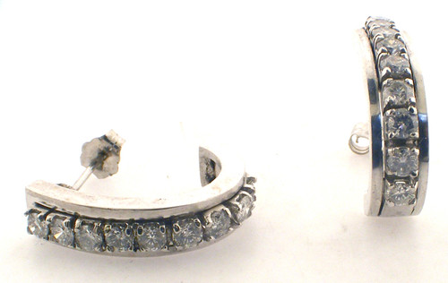 14 karat white gold half hoop diamond earrings weighing 7.3 grams.  Diamonds weigh approx 1.0 ct tw