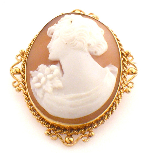 14Karat yellow gold cameo pin with an ornate gold boarder around the cameo. Pin weighs 8.7 grams.