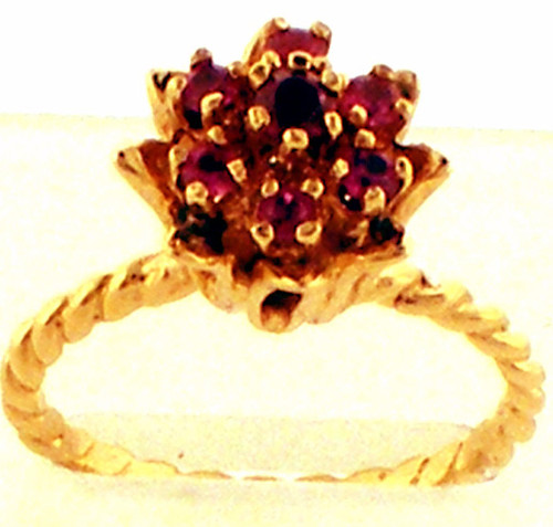 14 karat yellow gold ruby flower cluster ring weighing 3.5 grams. Finger Size 7.25