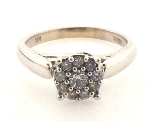 10 karat white gold diamond cluster ring weighing 3.0 grams. Diamonds weigh approx .20ct TW  H-I, SI2, Finger size 5