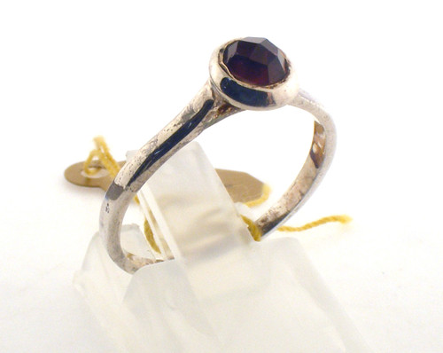 Sterling silver and garnet ring. The total weight of the ring is 1.5 grams and the ring is made for a finger size of 7.