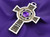 Celtic cross with amethyst center stone and braid around the center stone. in 14K gold, cross weighs 78 grams. This is a CAD design which allows it to be madein different specifications- price will be quoted