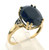 10 karat yellow gold very dark garnet and diamond ring weighing 3.6 grams.  Finger size 8