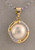 14 karat yellow gold mabe pearl and diamond pendant weighing 3.6 grams.  Mabe is 13mm