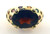 10 karat yellow gold 14x10 checkerboard garnet and multi color stone ring weighing 7.3 grams.  Finger size 7.25