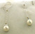 14 karat white gold diamond and pearl drop earrings.  6mm pearls and Diamonds weigh approx .10ct tw.  1.9 grams
